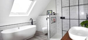 white bathroom with modern black fittings in loft conversion