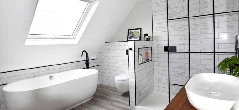 white bathroom with modern black fittings in loft conversion