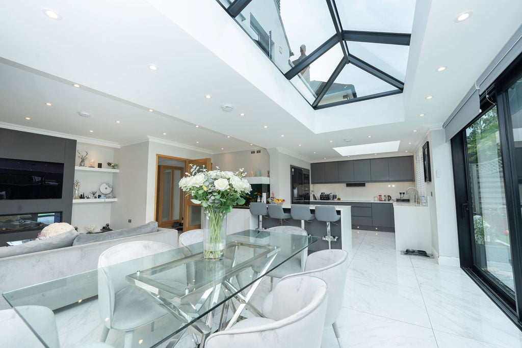 kitchen diner extension with sliding glass doors and skylight